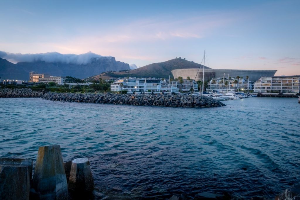 Beautiful sunset over Cape Town's waterfront with Table Mountain and the stadium in the background.